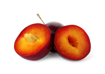 Whole and cut ripe plums isolated on white