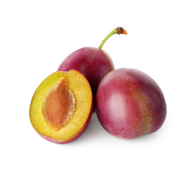 Whole and cut ripe plums isolated on white