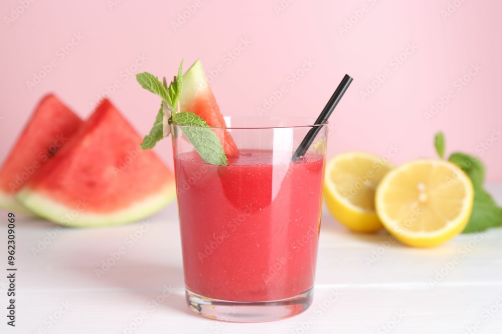 Canvas Prints Tasty watermelon drink in glass, mint and fresh fruits on white wooden table