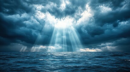 Sun rays breaking through dark storm clouds over the ocean, dramatic weather, hope after the storm
