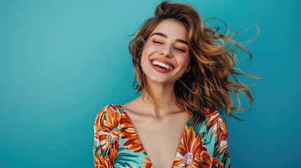Fototapeta premium A beautiful young woman smiles with her long hair flowing, perfect for editorial or personal use