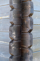 corner of a wooden gazebo built on the principle of a Russian hut