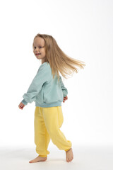 Portrait of beautiful cute little toddler girl. Child with funny face. Pretty smile kid in studio on white background. High quality photo