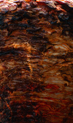 Close up of pork meat on a spit roast 