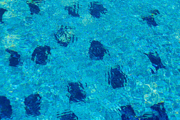 Beautiful sun reflections of water in the pool. Summer. Flight holidays