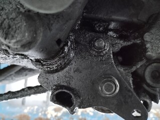 Leaking motorbike oil seeps into the bottom of the motorbike