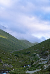 The sunlit slopes of Amaklit Plateau in Camlihemsin, with rugged rocks