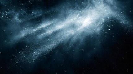 Obraz premium A dark blue night sky with a large, glowing cloud of stars in the center.