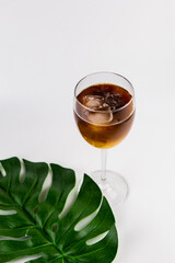 glass with cold iced coffee on a white background