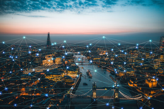 Aerial panoramic sunset cityscape view of London scenery big data network connections