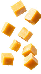 Bite sized cheese cubes floating against an isolated, transparent background