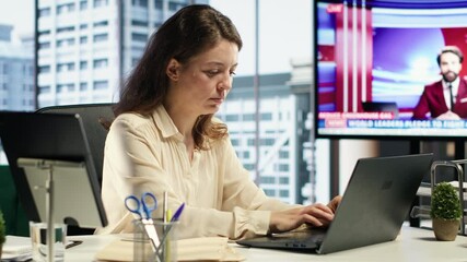 Portrait of powerful woman CEO working in a modern corporate office, managing daily business operations, optimizing workflow and ensuring the company meets its performance targets. Camera A.