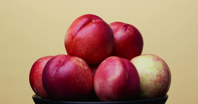 nectarine on a plate, juicy fruit all-round view