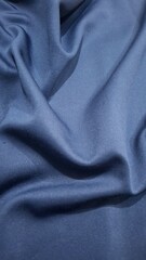 Fototapeta premium Smooth elegant blue silk or satin luxury cloth texture can use as abstract background.Blue cloth or liquid wave or wavy folds of grunge silk texture satin velvet material. Christmas background. Vector