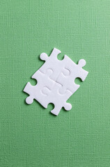 Four elements from puzzle on green background. Concept of team work, business, community and...