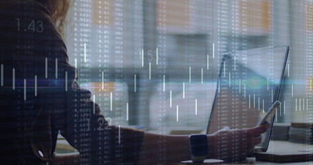 Image of diagrams and data processing over businesswoman using laptop