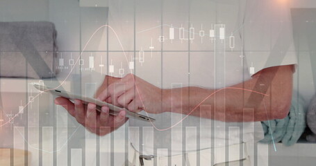 Image of financial data processing over caucasian businessman using tablet