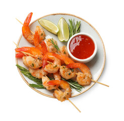 Delicious grilled shrimp skewers with sauce and lime isolated on white, top view