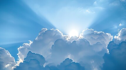 Fluffy Clouds and Bright Sun on a Clear Blue Sky