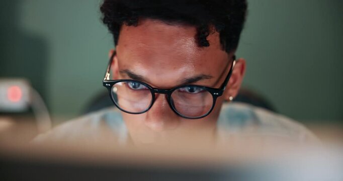 Thinking, reading and man at computer with glasses, working and planning for online project at digital agency. Research, internet and consultant at desk for article review, report or laptop in office