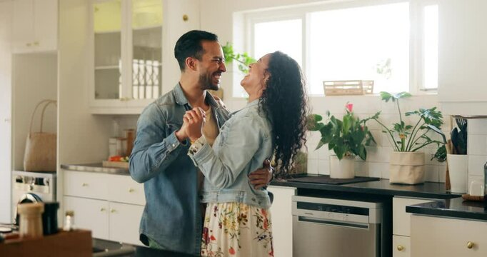 People, couple and happy with dancing in kitchen for anniversary celebration, bonding and fun. Family, relationship and smile or laughing as newlyweds at home for care, support and trust with music