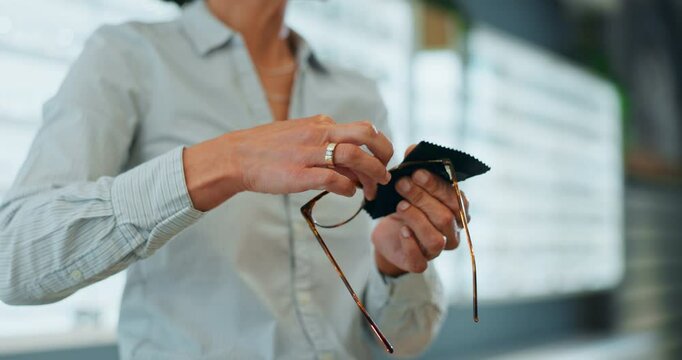 Cleaning, glasses and optometry with hands of person for dust, vision and lens protection. Eye care, health and ophthalmology with closeup of spectacles and cloth for hygiene, optical and cleaner