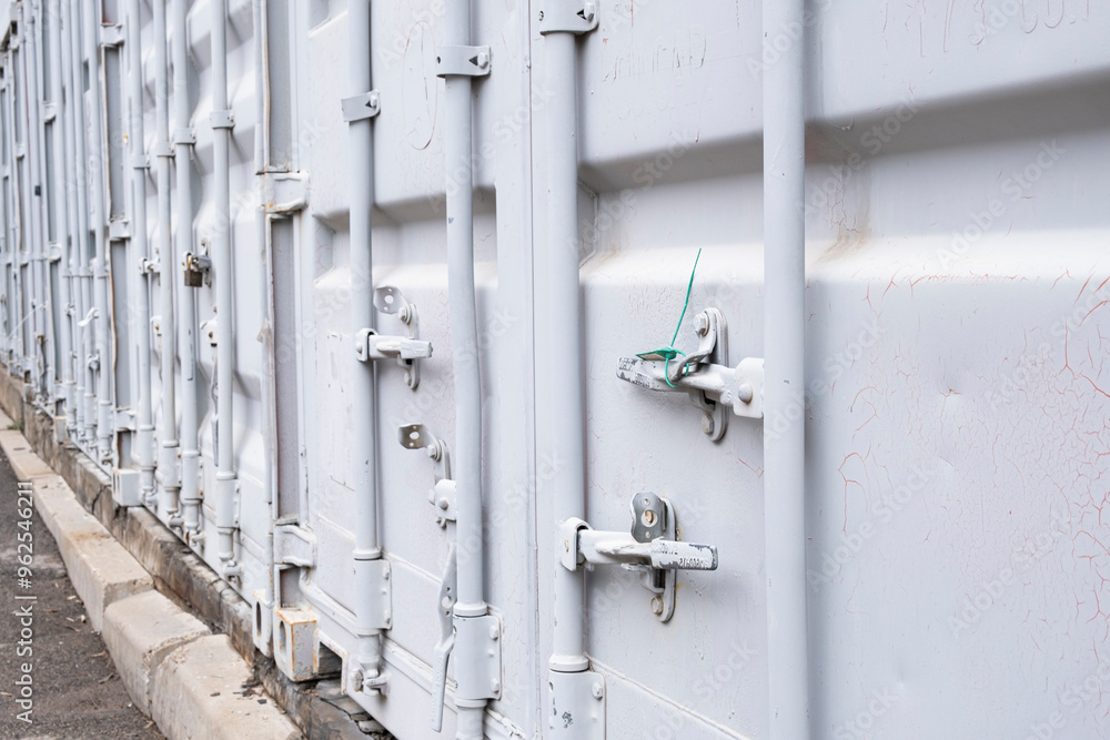 Wall mural a closed and sealed container door, a guarantee of transportation and safety of cargo.