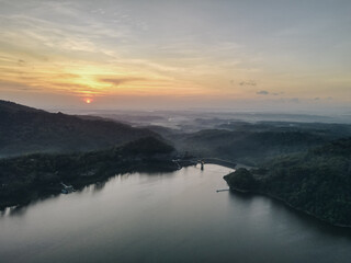 Fototapeta premium Top aerial view landscape of clear lake named Sermo lake on a bright day.
