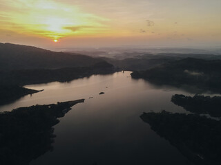 Fototapeta premium Top aerial view landscape of clear lake named Sermo lake on a bright day.
