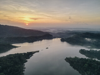 Fototapeta premium Top aerial view landscape of clear lake named Sermo lake on a bright day.