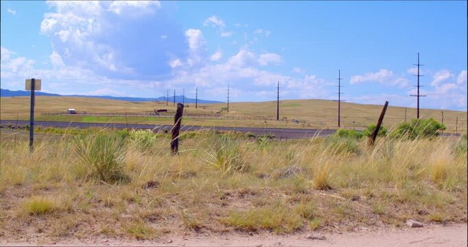 Country Road With Car Driving In Distance
