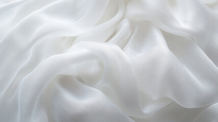 Fototapeta premium Delicate white silk fabric draping softly in natural light, creating a serene ambiance