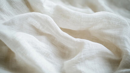 Soft white fabric gently draped and illuminated to highlight its texture and flow