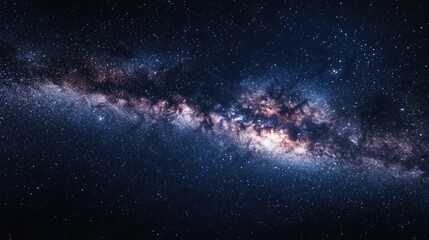 Obraz premium A starry night sky with the Milky Way galaxy visible, enhanced by the faint glow of light pollution from a distant city