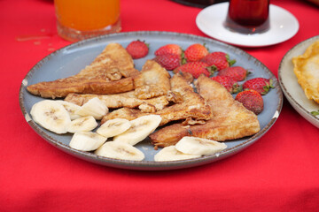Indulge in a delicious and delightful Fried Banana and Strawberry Platter today