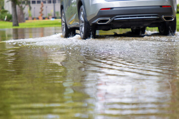 Car driving in flood