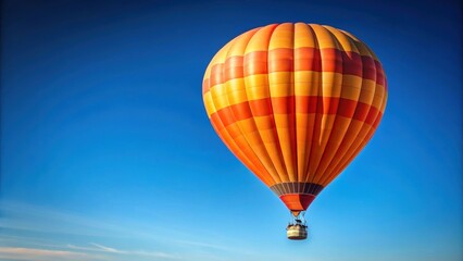 Fototapeta premium Beautiful orange air balloon floating in the clear blue sky, hot air balloon, aerial, transportation, adventure, journey