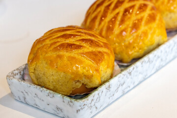 Freshly baked pineapple buns on plate