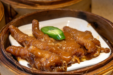 Chicken feet dim sum in bamboo steamer