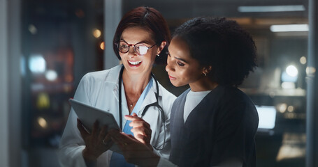 Night, smile or doctor with surgeon on tablet reading online for news update or late schedule in...