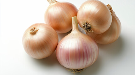 Fototapeta premium Five fresh, golden onions with a glossy sheen are arranged on a white surface, showcasing their smooth skins and natural beauty.