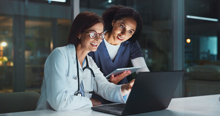 Night, doctor and nurse on laptop for good news or reading online reading schedule in hospital on...
