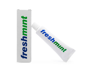 tube of mint toothpaste and a cardboard box