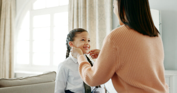 School, dressing and mom with child in home getting ready for education, learning and classes. Family, morning routine and happy mother with girl prepare with tie, uniform and clothes for academy