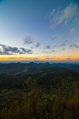 Colorful sky sunset on peak of mountain tropical forest
