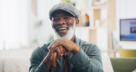 Elderly man, portrait and retirement in house for relax, peace and positive mood on weekend on sofa. Black person, face and happy in living room on couch for comfort, optimistic or rest with cane - Powered by Adobe