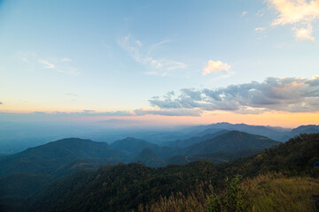 Colorful sky sunset on peak of mountain tropical forest