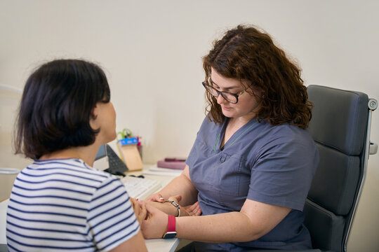 Female phlebologist conducts an appointment in the clinic