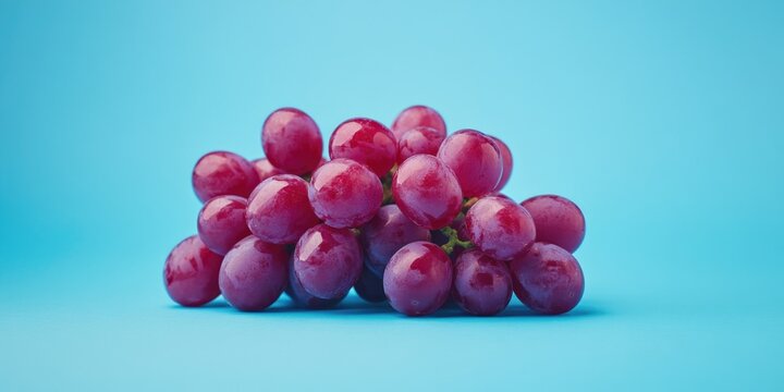 Grapes on blue surface