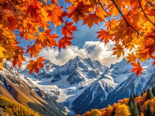 Autumnal Foliage Of Vibrant Orange And Yellow Maple Leaves Against A Backdrop Of Rugged, Snow-Capped Mountain Peaks